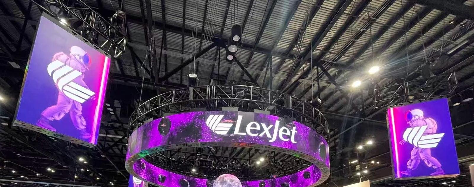 Two hanging LED rings, flown LED walls and an LED sphere over the LexJet booth at Printing United