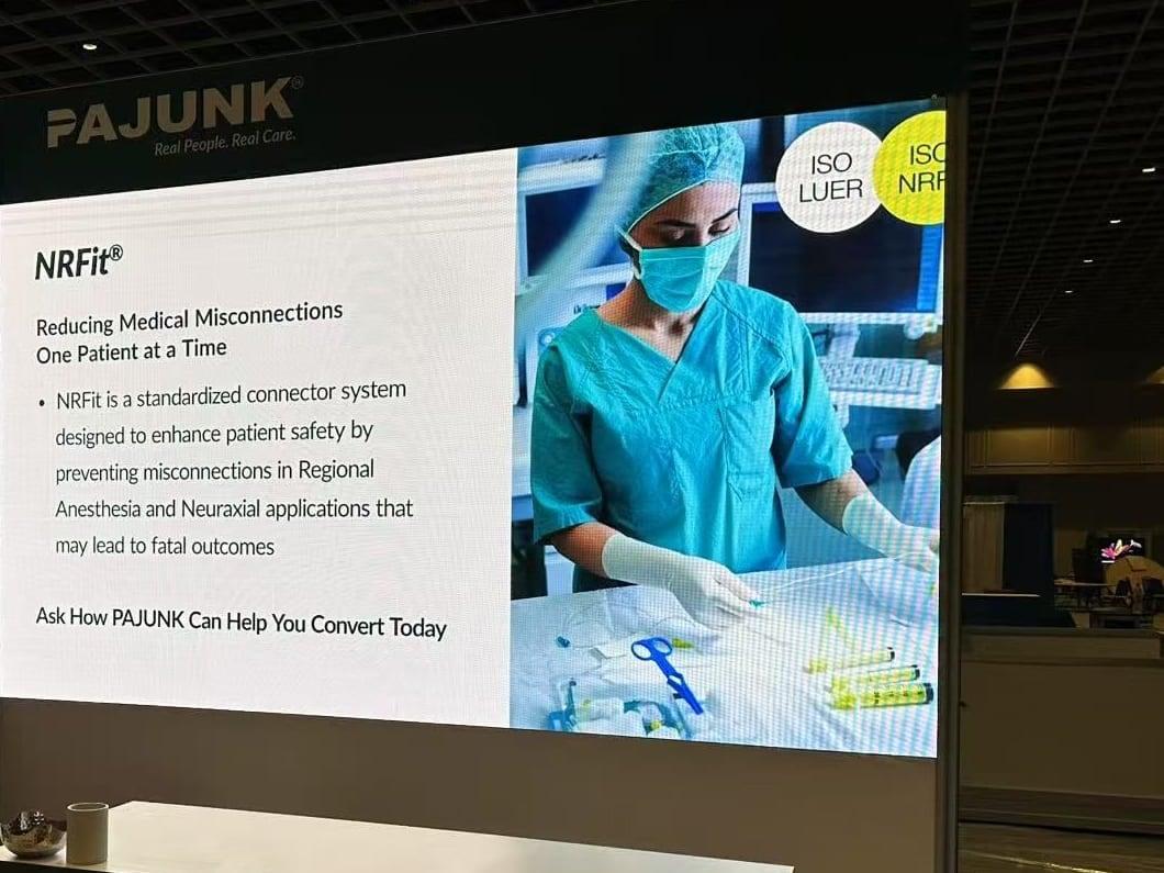LED back wall showing a product slide in the PAJUNK booth at ASRA 2025, Rosen Shingle Creek, Orlando