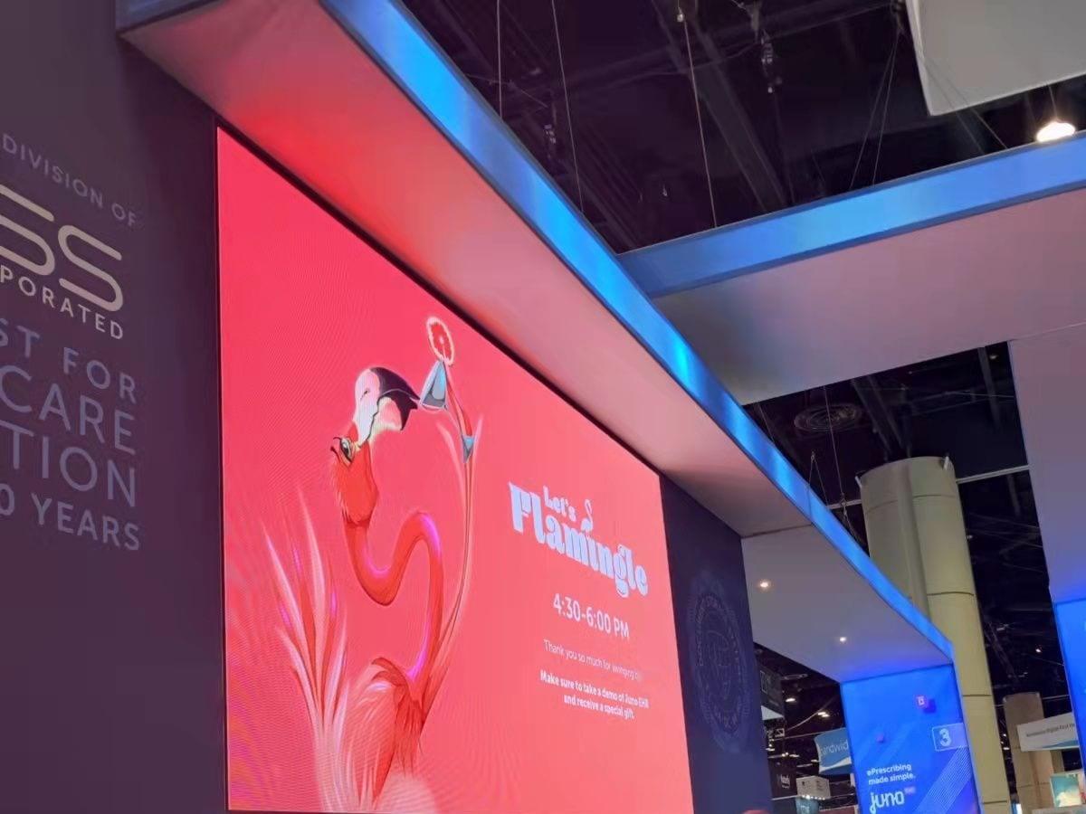 LED back wall with pink flamingo artwork in the DSS booth at HIMSS 2022, Orange County Convention Center, Orlando