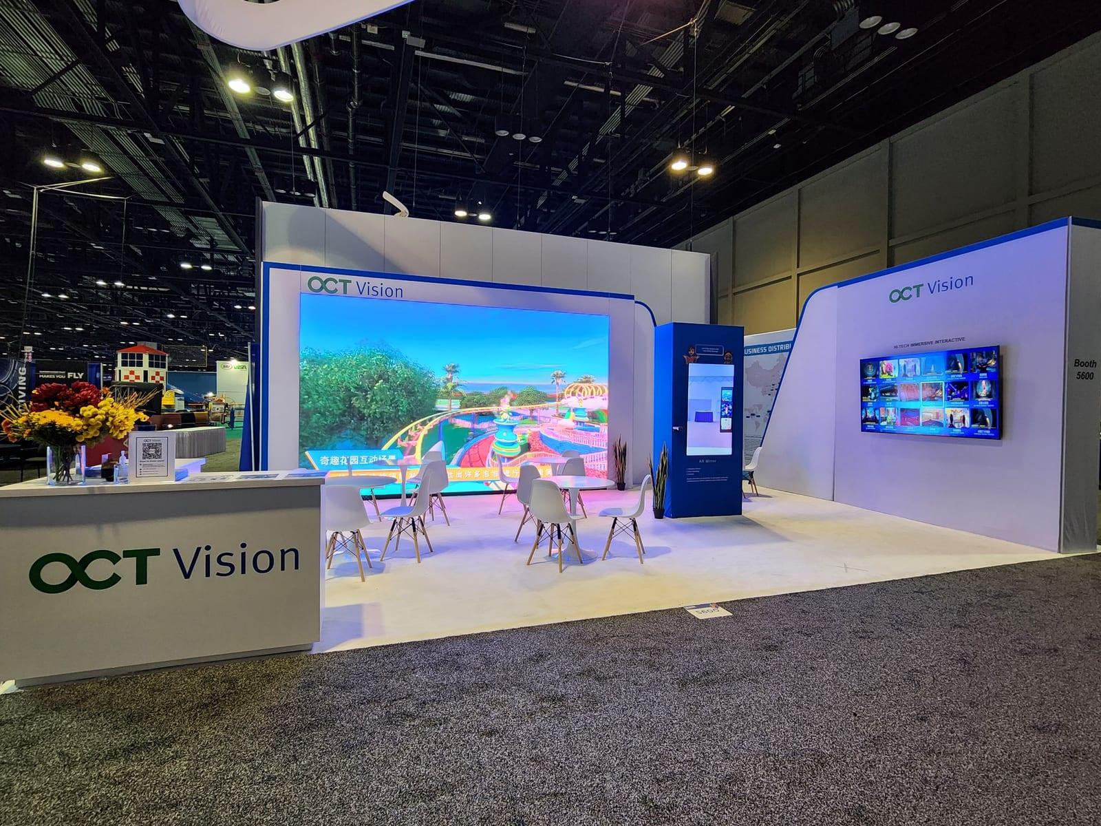 LED back wall showing theme-park footage in the OCT Vision booth at IAAPA Expo 2022, Orange County Convention Center, Orlando