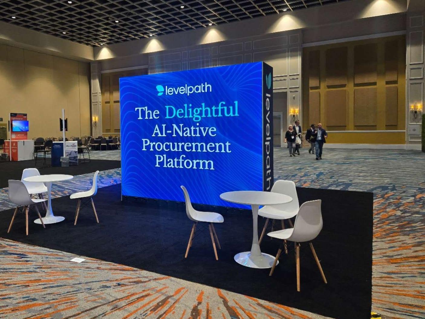 Freestanding LED wall behind cafe tables in the Levelpath booth at ISM World 2025, Rosen Shingle Creek, Orlando