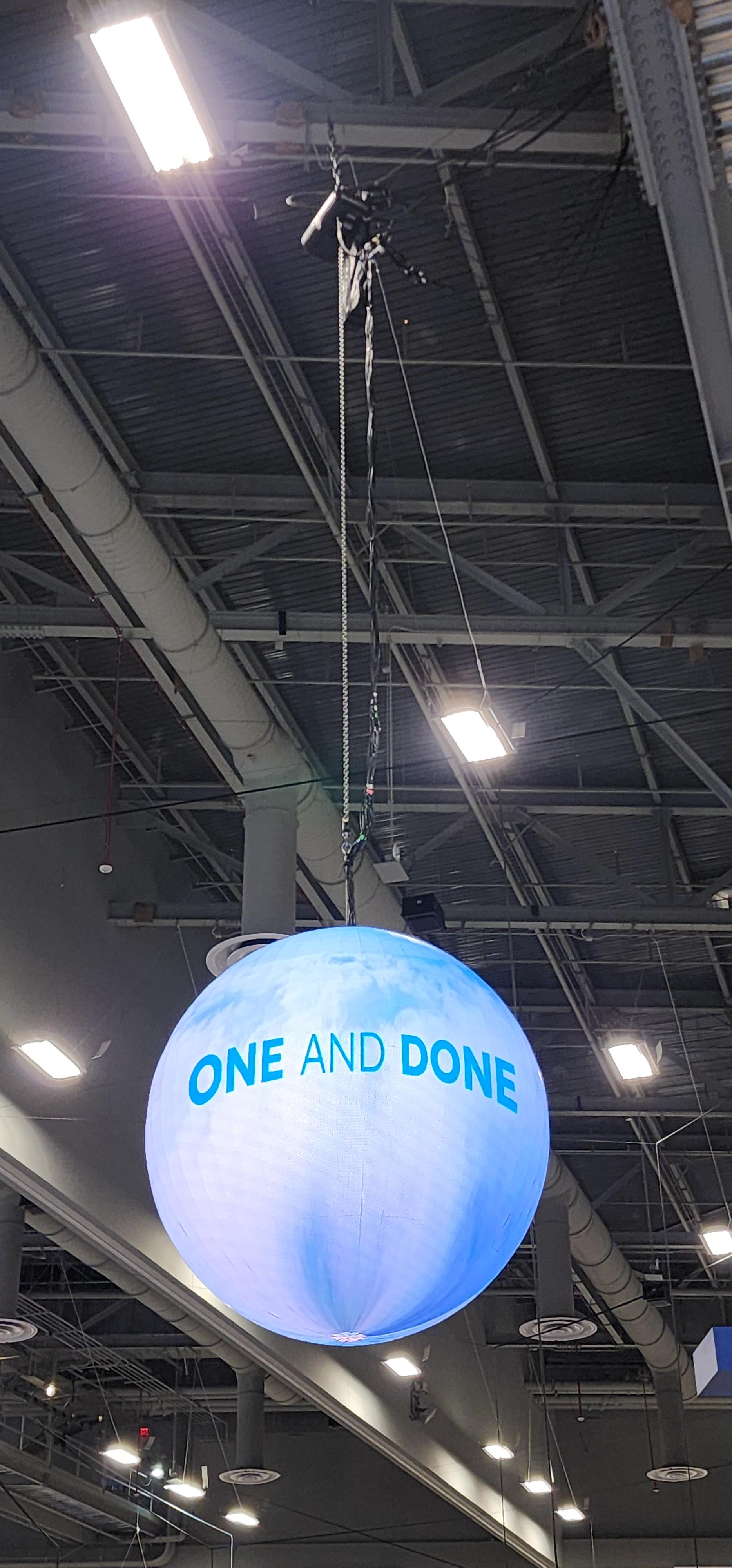 TLL LED sphere hung from the ceiling of a convention hall