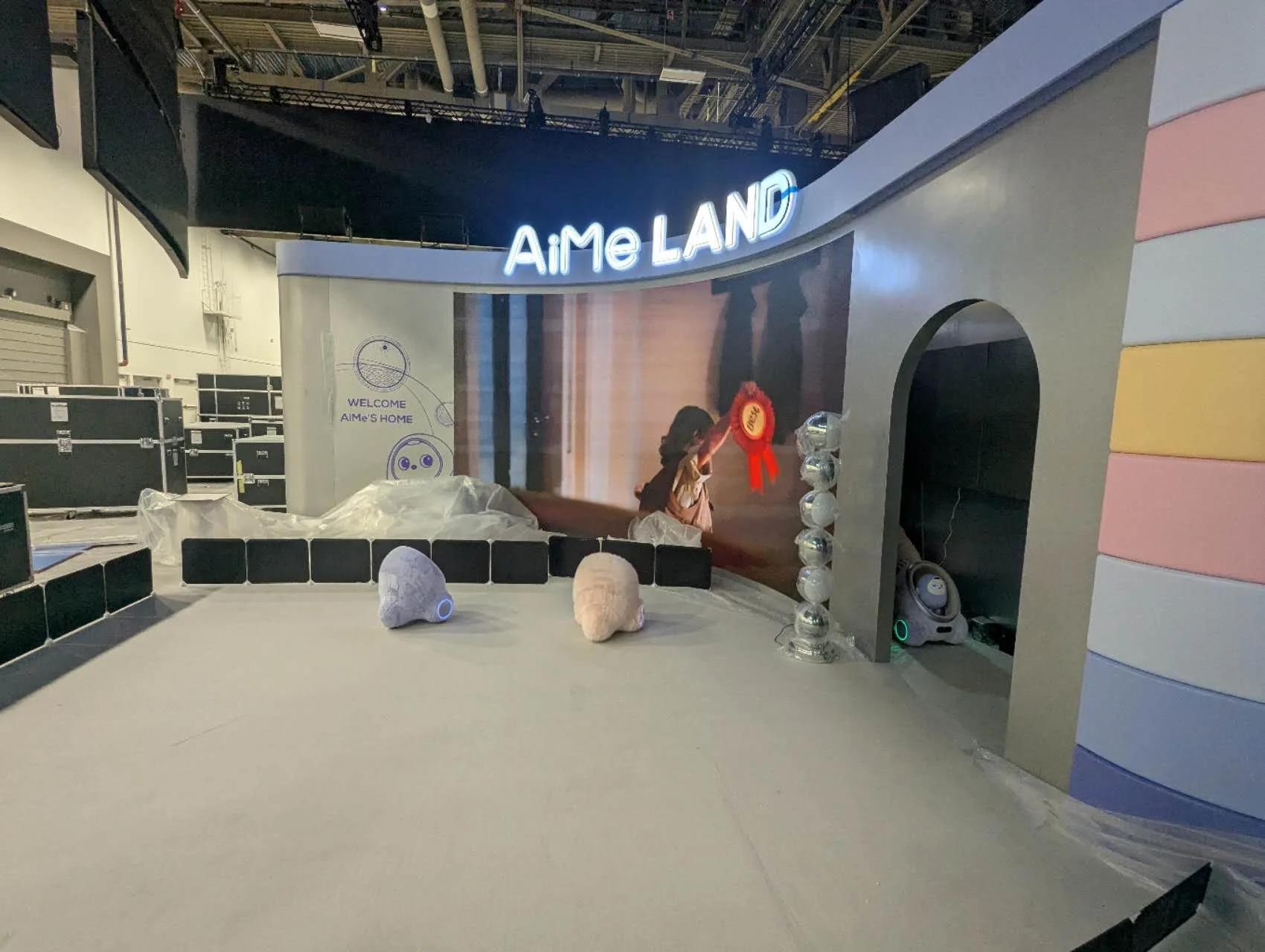 The AiMe LAND corner of the TCL booth at CES during install, with its LED wall in place